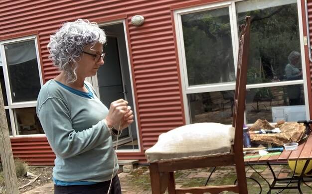 ART: Genevive Lilley working on her textile art. Pocture: CONTRIBUTED