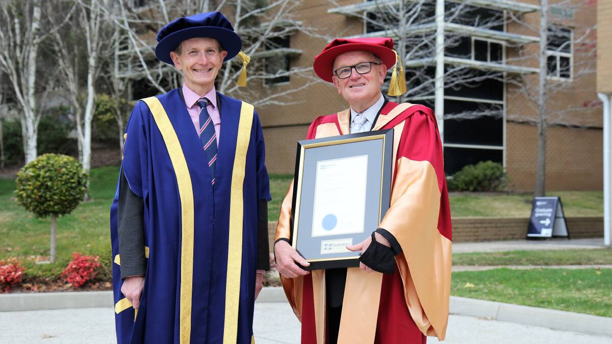 Federation University Vice-Chancellor and President, Professor Duncan Bentley presents Michael Ryan with an honorary doctorate.