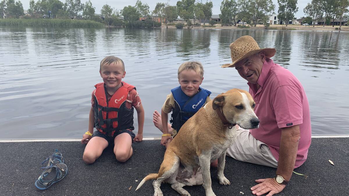 PLAT TIME: Jed and Hugh Vardy, 8, with Pa Allan Reid having a break in the water along with loyal dog, Oscar. Allan and the twins are staying at the caravan park enjoying time before school goes back. Picture: ALISON FOLETTA.