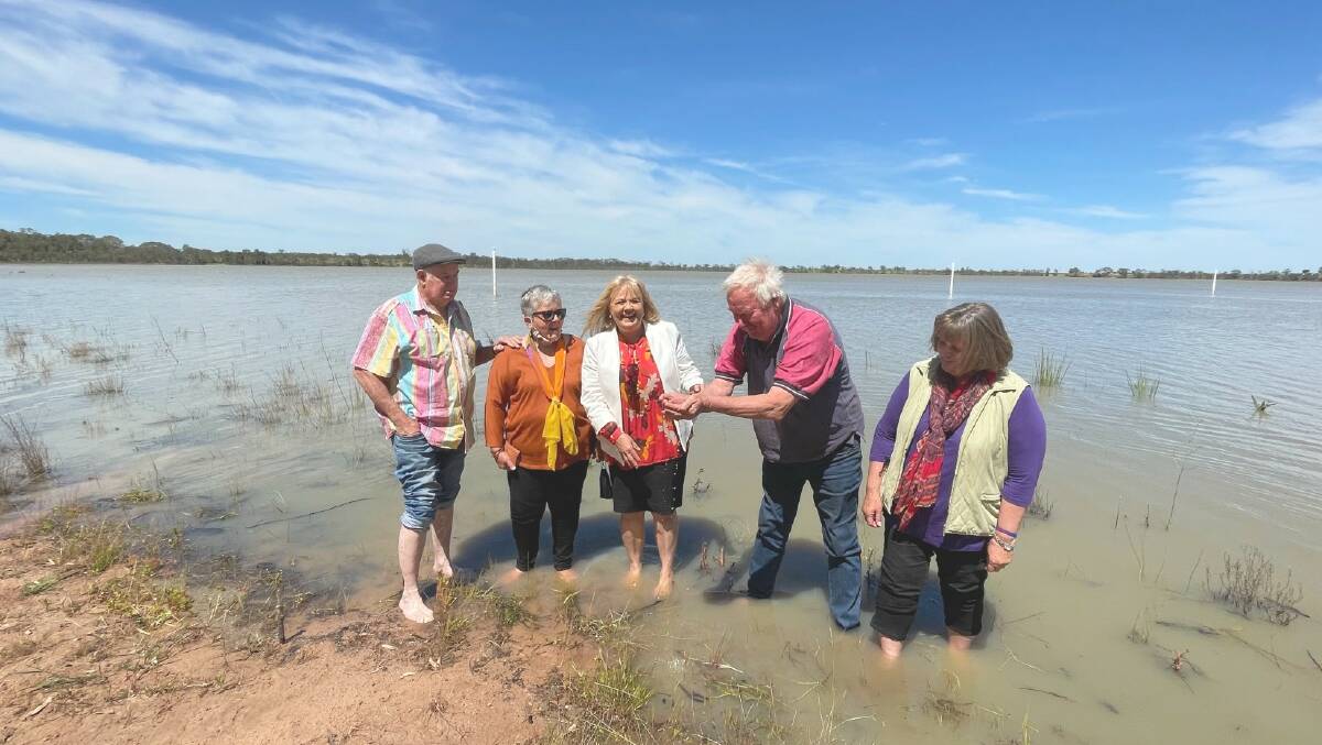 SPLISH SPLASH: Noel and Betty Janetzski, Claudia Haenel, Neville McIntyre and Libby Peucker cool of their feet in Green Lake, all ecstatic too see if flush with water. Picture: ALISON FOLETTA