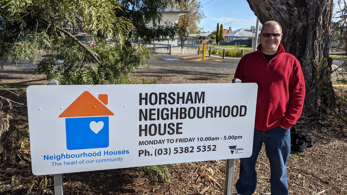 NEIGHBOURS: Horsham Neighbourhood House manager Charlie Helyar with the new sign. Picture: CONTRIBUTED
