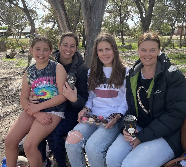 THE GIRLS: Charlotte Kelly, 9, sits with mum, Kristy Kelly, with Macy, 15 and her mum, Lisa Uebergang for a picnic time catch-up. Picture: ALISON FOLETTA