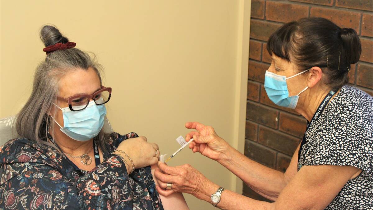 WELL DONE: Wimmera Health Care Group nurse Carolyn Bird vaccinating Horsham's Kellie McMaster. Picture: CONTRIBUTED