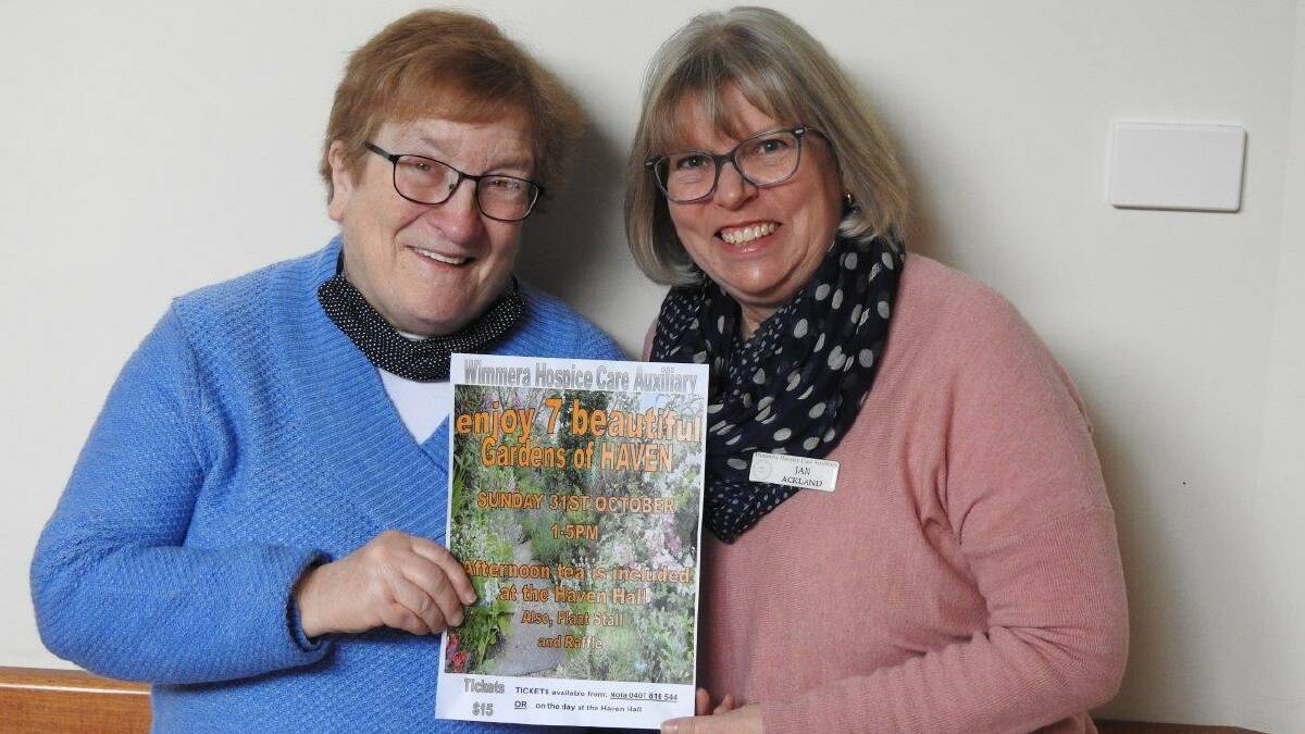 FUNDRAISING: Jane Bolwell (left) and Jan Ackland holding a poster for the Gardens of Haven event. Picture: CONTRIBUTED