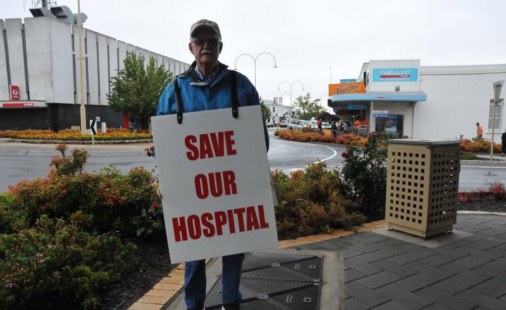 MERGER: Bill Ower protesting the health service amalgamation on Firebrace Street in January. Picture: FILE
