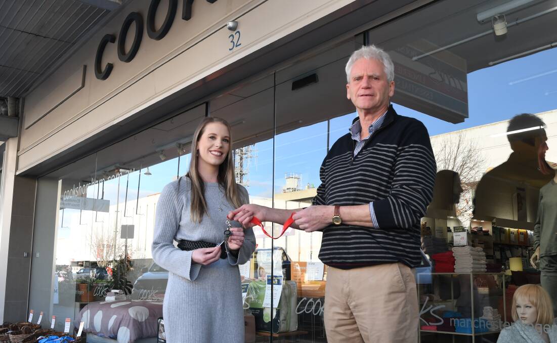 NEXT GENERATION: John Latimer hands the keys over to Kelly Smithyman, who part-owned the business with Mr Latimer since 2019. Picture: ALEX DALZIEL
