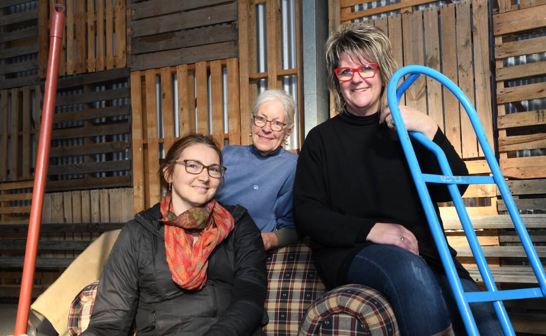 BIG PLANS: Art Is... Festival director Sarah Natali (left), Lynne Quick and Andrea Cross take a break from preparing Maydale Reserve for the weekend's event. Picture: ALEX DALZIEL