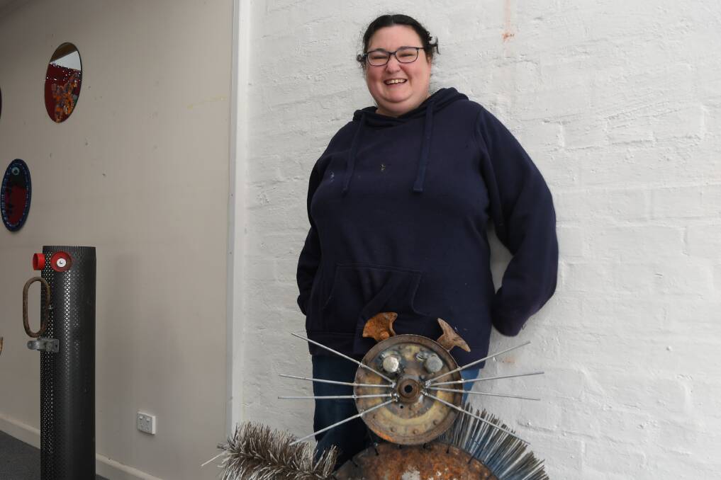 ART: Amy Benbow with her cat sculpture, made from recycled materials. Picture: ALEX DALZIEL