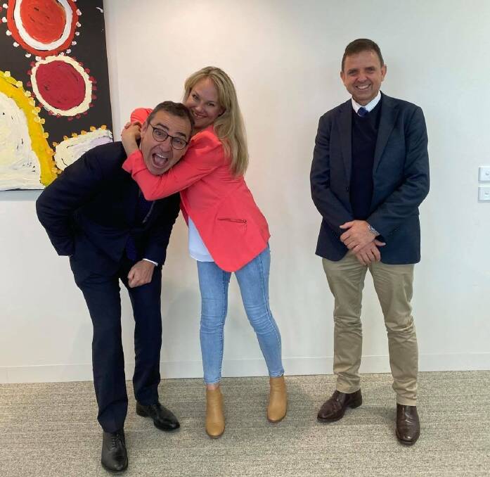 HEADLOCK: Steven Marshall, Paula Gust and Nick McBride having a bit of fun following their weekend meeting. Picture: CONTRIBUTED