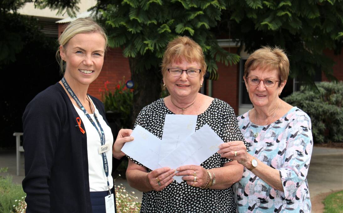 CHOICE: Grampians Health director of Residential Services at Horsham and Dimboola Sarah Kleinitz accepts the three cheques from Wimmera Base Hospital Ladies Auxiliary executive Denise Queale and Elaine Morrison. Picture: CONTRIBUTED