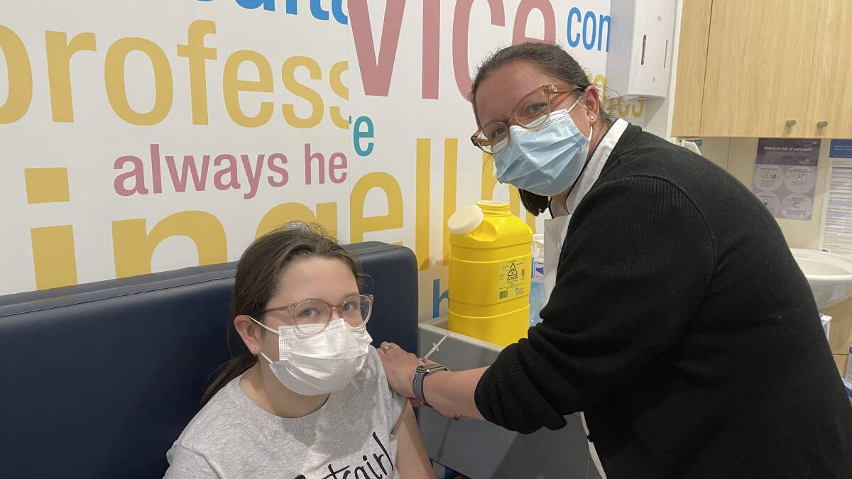 THOUSAND: Horsham Amcal Pharmacist Carlie Streeter vaccinates Wynter James. Picture: ALEX BLAIN