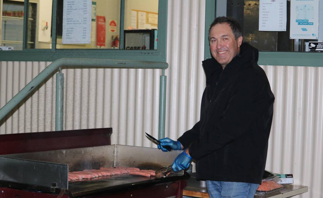SNAGS: Kee's Thursday night 'chef' Trav Kerr mans the barbeque. Picture: CONTRIBUTED