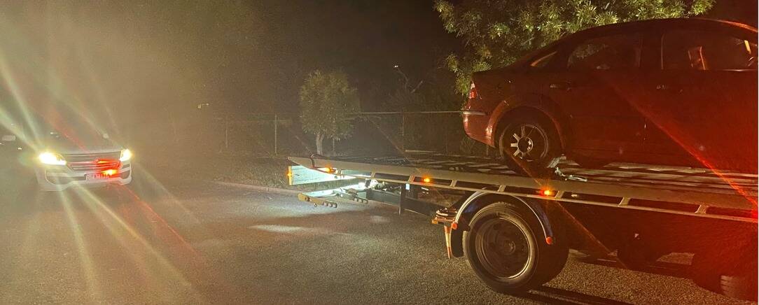OPERATION COMPASS: The red Ford Falcon impounded in Warracknabeal on October 31. Picture: VICTORIA POLICE