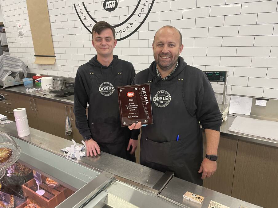 WINNERS: Kaniva IGA staff member Harry McFarlane and owner Lachlan Doyle stand with the store's Retail Transformation and Innovation Award. Picture: ALEX DALZIEL