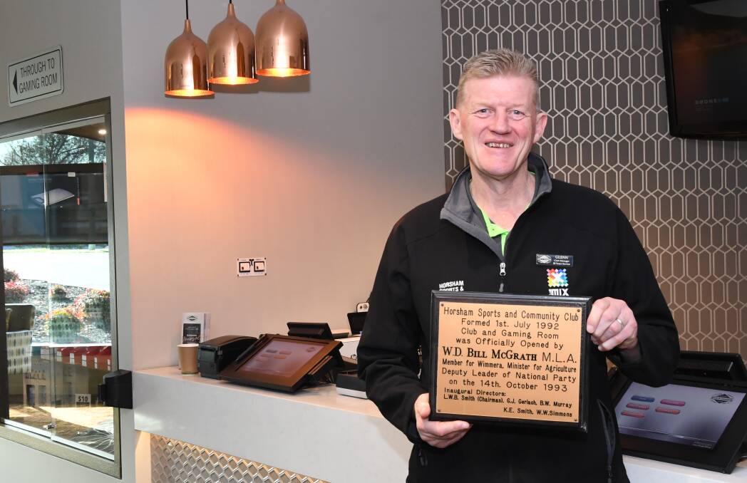 ANNIVERSARY: Horsham Sports and Community Club manager Glenn Carroll with a plaque commemorating the opening of the venue by then member for Wimmera Bill McGrath. Picture: ALEX DALZIEL