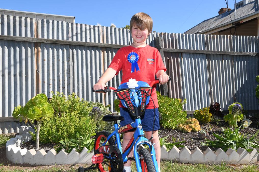 GIVING: Of his own volition, Jayden asked his mother if he could give away his old Spiderman bike to a family in need. Picture: ALEX DALZIEL