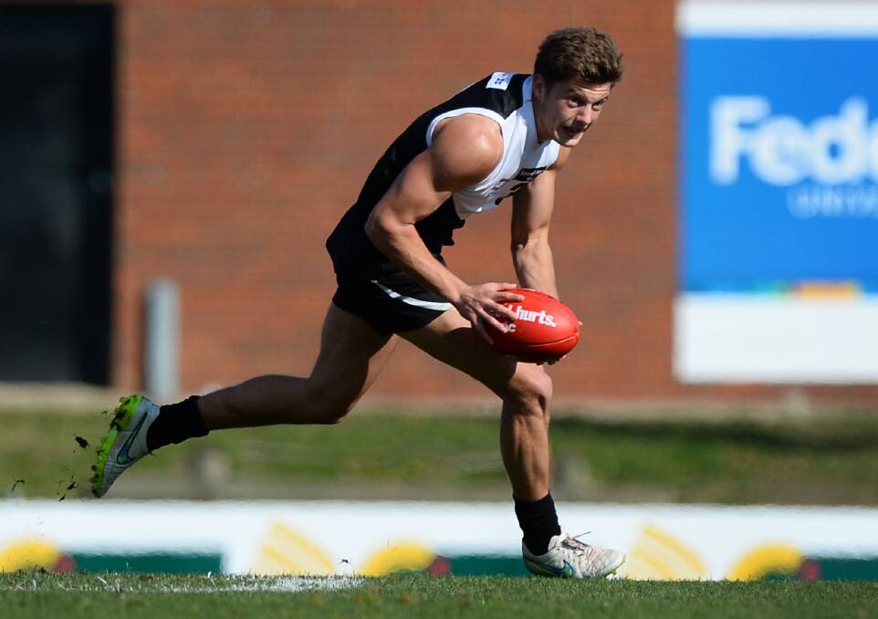 Tucker in action for the Rebels in 2015. Picture: Adam Trafford