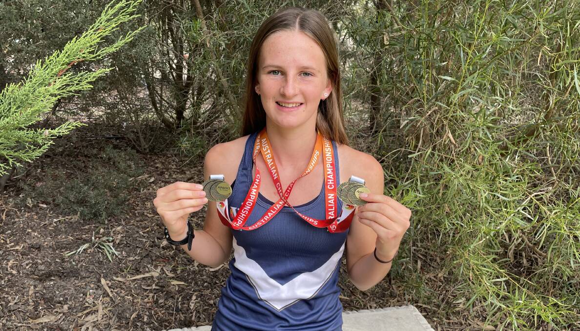 STAR: Daisy Sudholz with her two gold medals she won
at the 2022 Australian Track and Field Championships.
Picture: MATT HUGHES