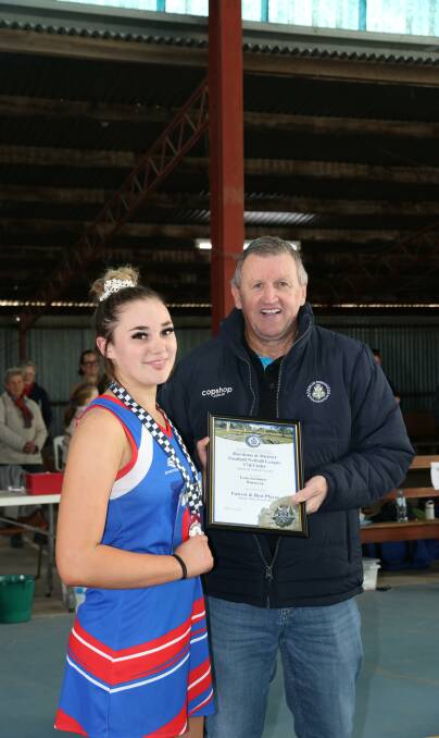 Tylea SCRIMIZZI photographed receiving her award at the netball from Blue Ribbon Member Les Power. Picture: CONTRIBUTED