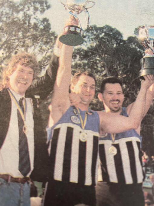 REWARDED: Malcom Schier (left) pictured in 1996 holding the Burras' premiership cup as president. Schier was awarded Minyip-Murtoa Life Membership recently. Picture: FILE