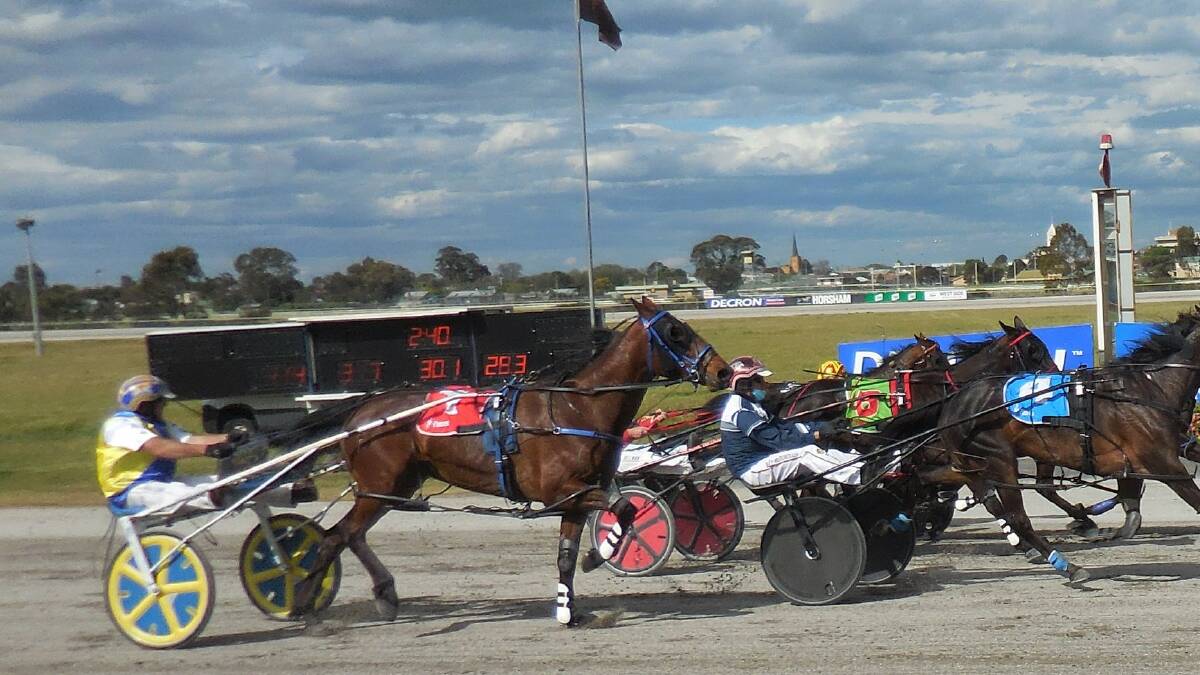 RACING: Horsham trainer/driver Aaron Dunn aboard his filly Potential Artist in last month's Alabar Horsham 3YO Classic. Picture: TONY LOGAN