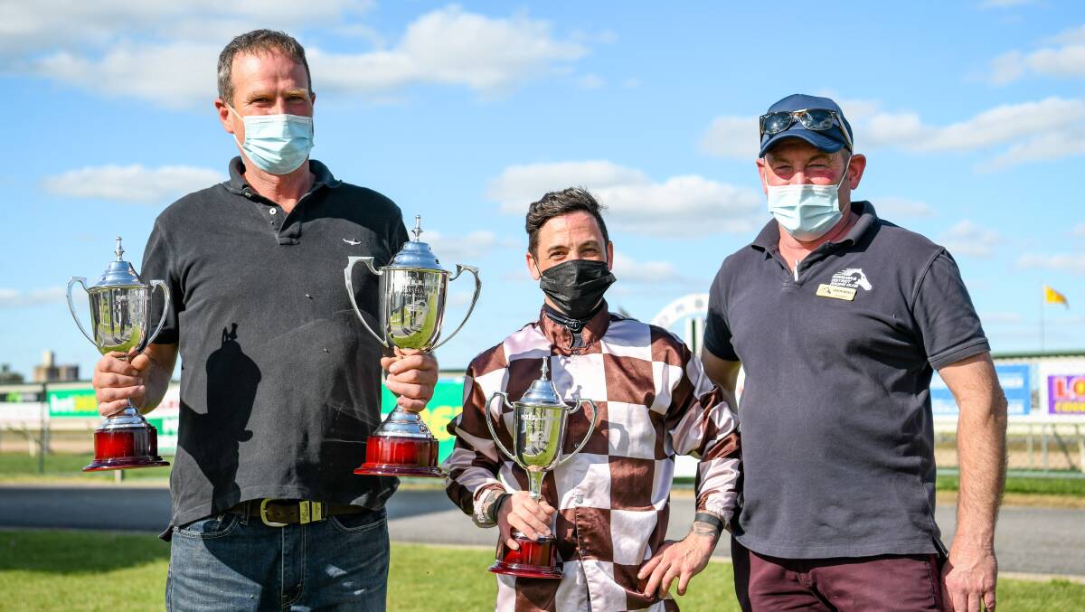 WINNERS: Jason Merlo (right) stands with Paul Preusker and Dean Holland after Orleans Rock won the 2021 Horsham cup. ALICE MILES/RACING PHOTOS
