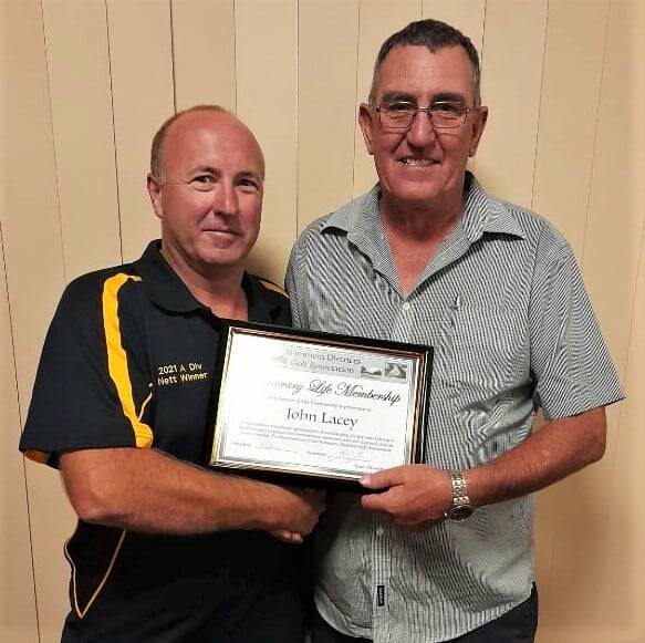 HONOURED: Wimmera District Golf Association president Lee English presents John Lacey with his Life Membership. Picture: JULIE WIRTH