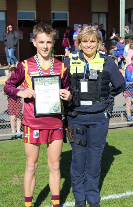 Shannon Taylor photographed receiving his award from Warracknabeal Police officer
Sergeant Kylie Newell.