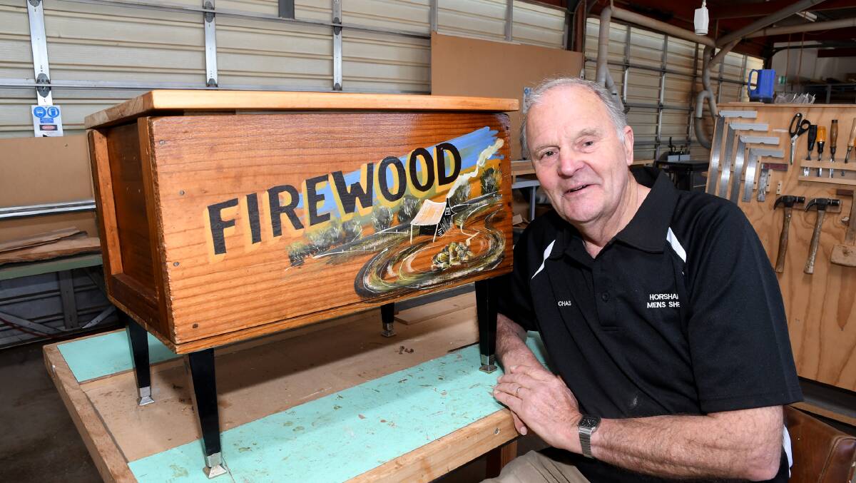 BEFORE COVID: Horsham Men's Shed coordinator Chas McDonald with a firewood box that was a project made by one of the men's shed members. Picture: SAMANTHA CAMARRI.