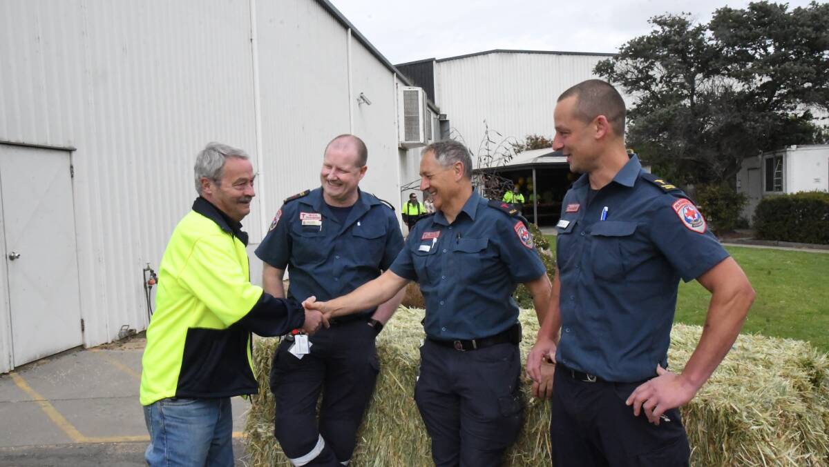 GRATEFUL: Jon Symes shaking the hand of John Kelly, the paramedic who stayed with him during the long drive to Ballarat. Picture: ALEX BLAIN