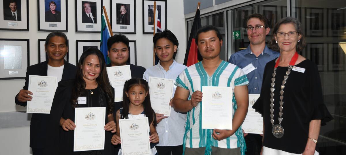NEW AUSSIES: The Vence family, along with Klo Lwe Moo Doh Soe and Daniel Liang, hold their certificates up along with Horsham Rural City Council mayor Robyn Gulline. Picture: ALEX BLAIN