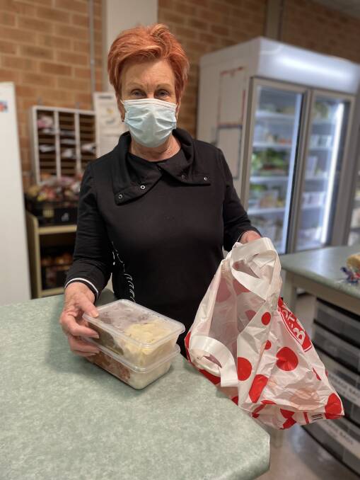 HELPFUL: Christian Emergency Food Centre volunteer Jenny Clarke helping pack the meals for delivery. Picture: CONTRIBUTED