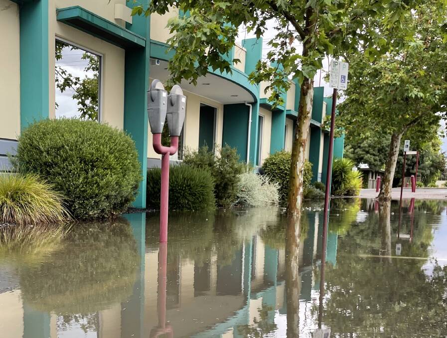 FLASH FLOODS: Be careful of flash flooding in Horsham, such as this footpath on McLachlan street, and across the Wimmera due to the heavy rainfall. Picture: ALEX BLAIN