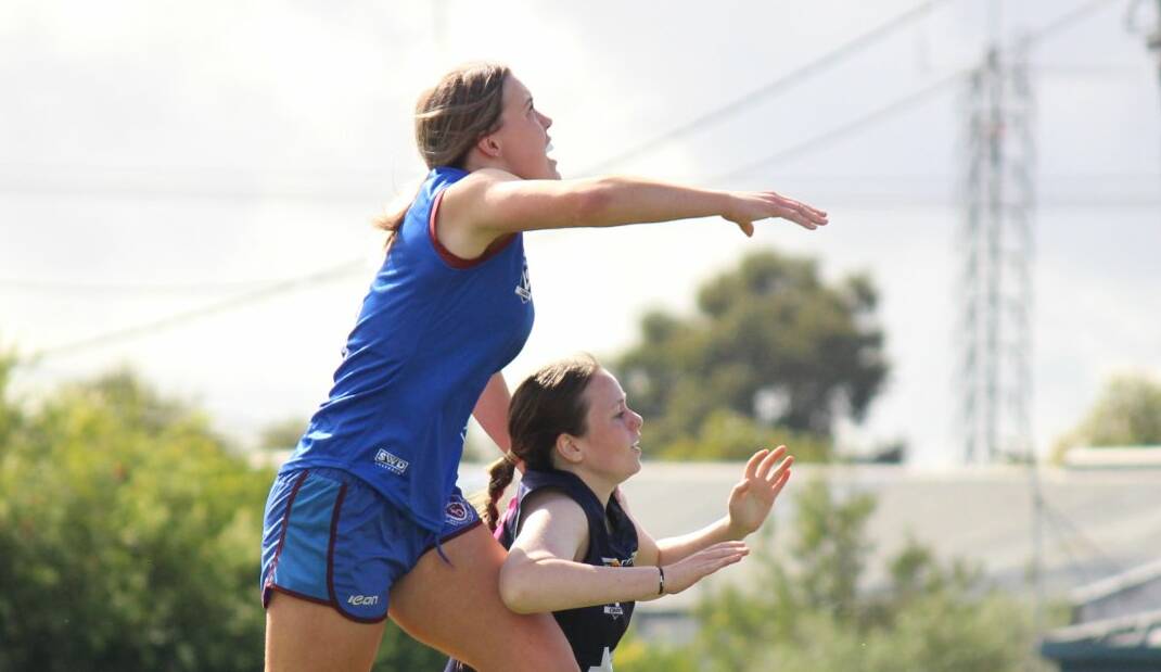 SKY HIGH: Horsham's Elle Treloar leaps over a Warrnambool Blue player for a mark against in round 5. Picture: CONTRIBUTED