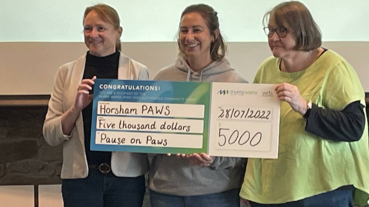 FUNDING: communications manager Susan Findlay Tickner presents Horsham PAWS secretary Kristy Kelly and Horsham PAWS president Bicki Johnstone a cheque for funding for the animal advocacy group's project Pause on Paws. Picture NICK RIDLEY