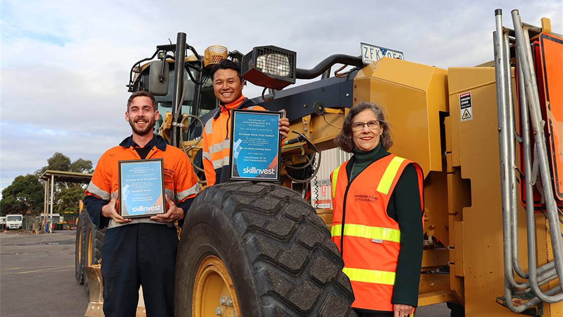 CERTIFICATE: Horsham mayor Robyn Gulline visited Ben Rowan and Johney Htoo after the pair officially completed their certificate three qualifications in civil construction. Picture: CONTRIBUTED