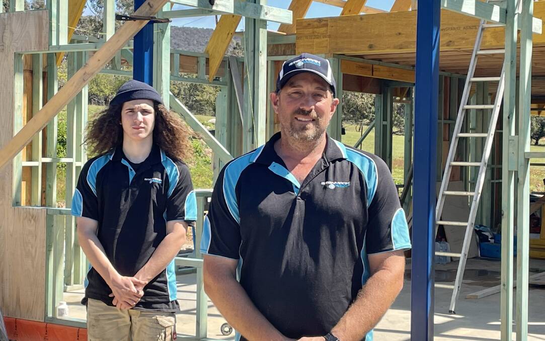 ON BOARD: Brenmark Building director Ben Gibson (pictuctured with apprentice Logan Gibson) said the vaccination mandate made sense. Picture: BEN FRASER