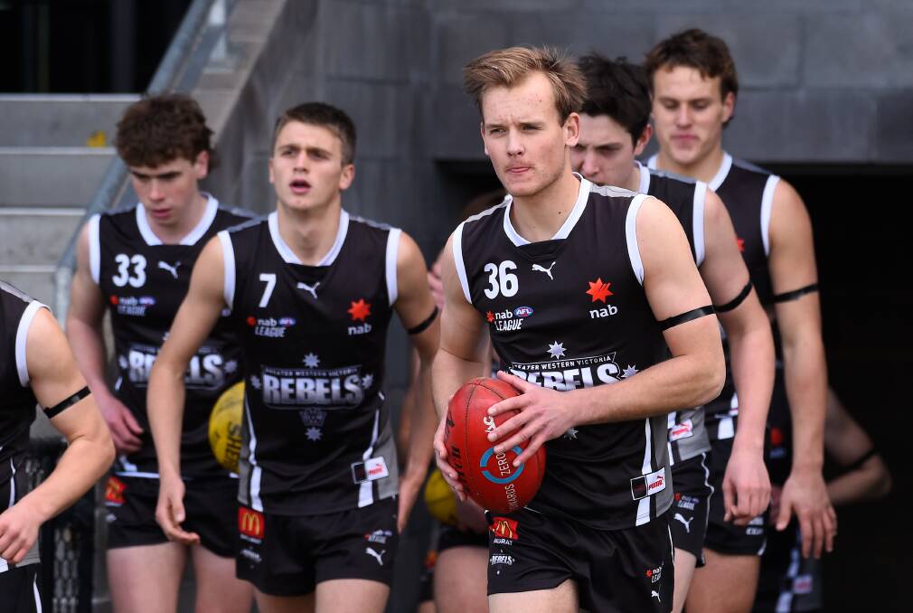 WAITING: Vincent Huf takes to Mars Stadium with his Rebels teammates. Picture: Adam Trafford