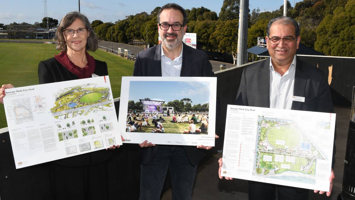 WIN: Horsham Rural City Council mayor Robyn Gulline (left), Minister for Tourism, Sports and Major Events Martin Pakula and chief executive Sunil Bhalla hold the City to River masterplan at City Oval. Picture: ALEX DALZIEL