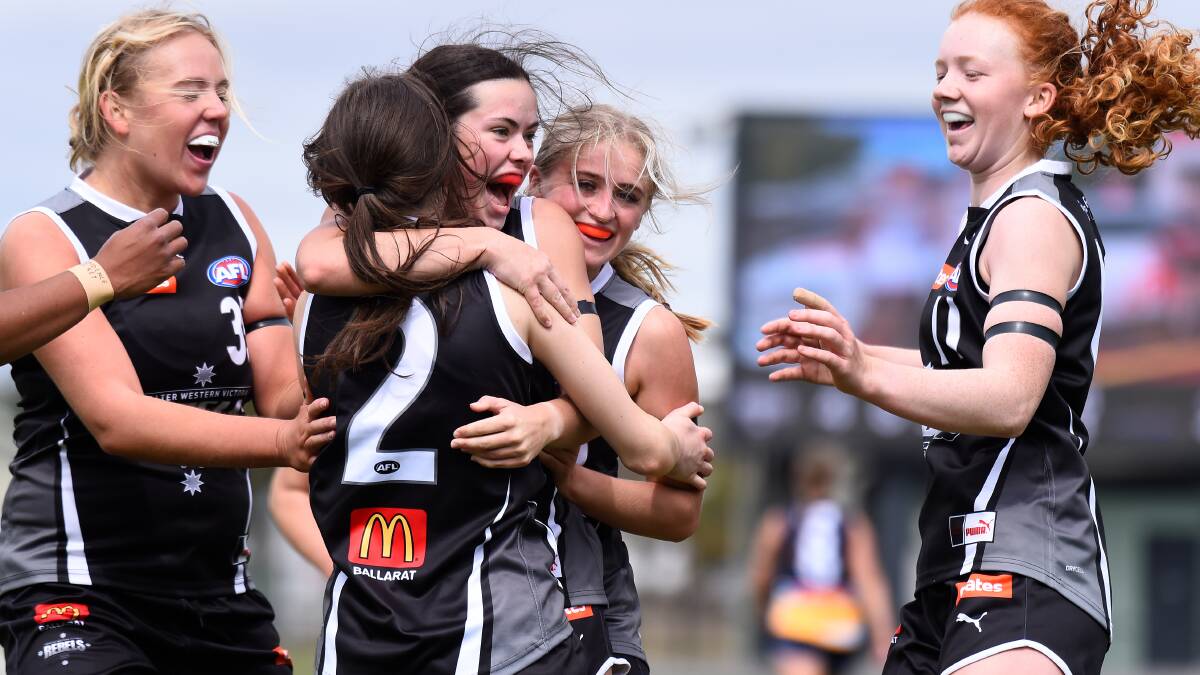 Rebels debutant Claire Lightfoot (middle) celebrates her first-ever Rebels goal with Zoe Burke of the Rebels (left) and Chloe Walker as Laila Lappin and Molly Walton join. Pictures by Adam Trafford