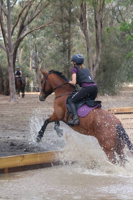 Kylie Bell going over the new water jump at the Horsham Pony Club Super Clinic on April 6. Picture supplied.
