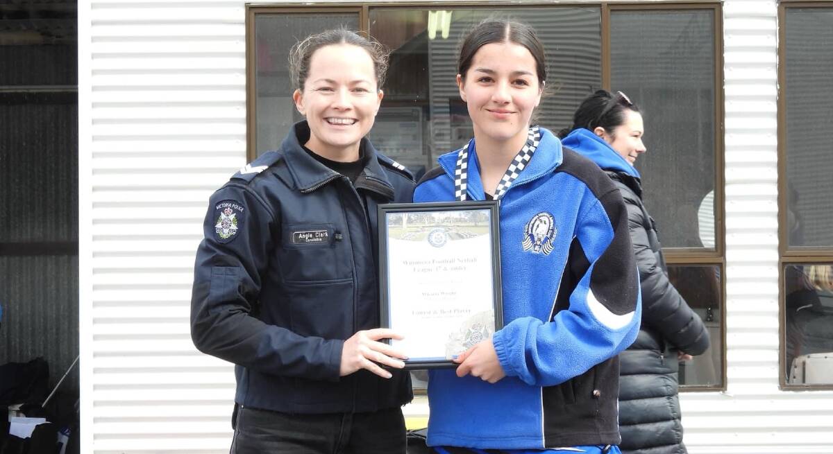 Minyip Murtoa's Mikaela Wright receives her Blue Ribbon Foundation Spirit of Netball award from Horsham police officer Senior Constable Angie Clark. Picture supplied 