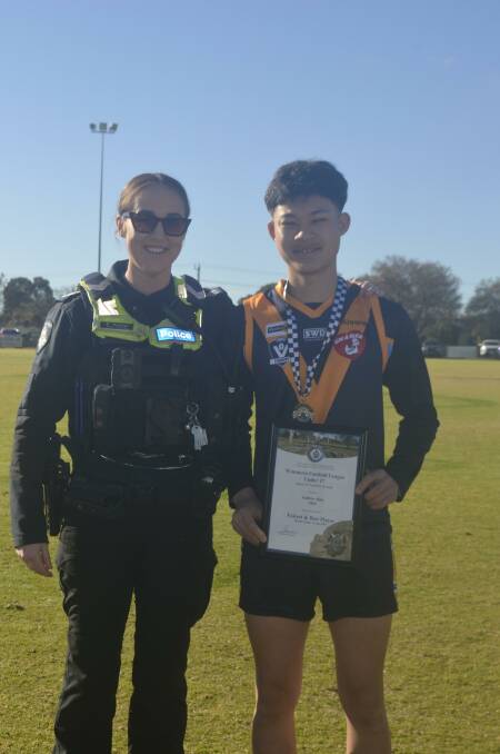 Nhill's Andrew Klee receives his Blue Ribbon Foundation Spirit of Sport award from Kaniva Police Officer Senior Constable Meaghan Husman. Picture supplied