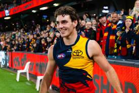 Hugh Bond celebrates Adelaide's two-point win over Essendon in round 19 of the AFL on Friday, July 19. Picture by Isabella Hughes