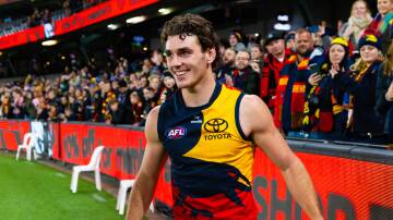 Hugh Bond celebrates Adelaide's two-point win over Essendon in round 19 of the AFL on Friday, July 19. Picture by Isabella Hughes