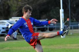 Rupanyup's Cam Weston kicks from a mark against the Swifts in round 10 of the HDFNL. Picture by John Hall