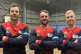 Laharum Demon's reserves captain Joel Pymer, senior co-coach Robbie Miller and senior captain Jarrod Kemp wearing their TAC Road Safety Round armbands. Picture by John Hall