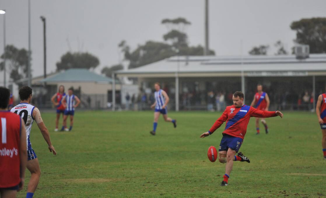 Kalkee's Jayden Kuhne launches a drop punt up field from the team's left wing in the Kees opening round match up against Harrow-Balmoral at the Kalkee Recreation Reserve on Saturday, April 15. Picture by John Hall