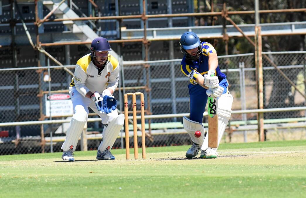 Lubeck Murtoa's Shannon Reddie brings out his front foot defence as Horsham Tigers' wicket keeper Martyn Knight stands up to the stumps at Horsham's City Oval. Picture by Lucas Holmes