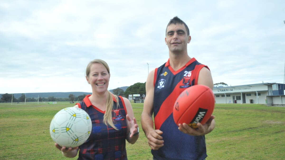Laharum Demons netballer, Shannon Arnott, and football captain, Brett Ervin show off the clubs heritage strip, to be worn as the club celebrates its centenary on the weekend of June 14.